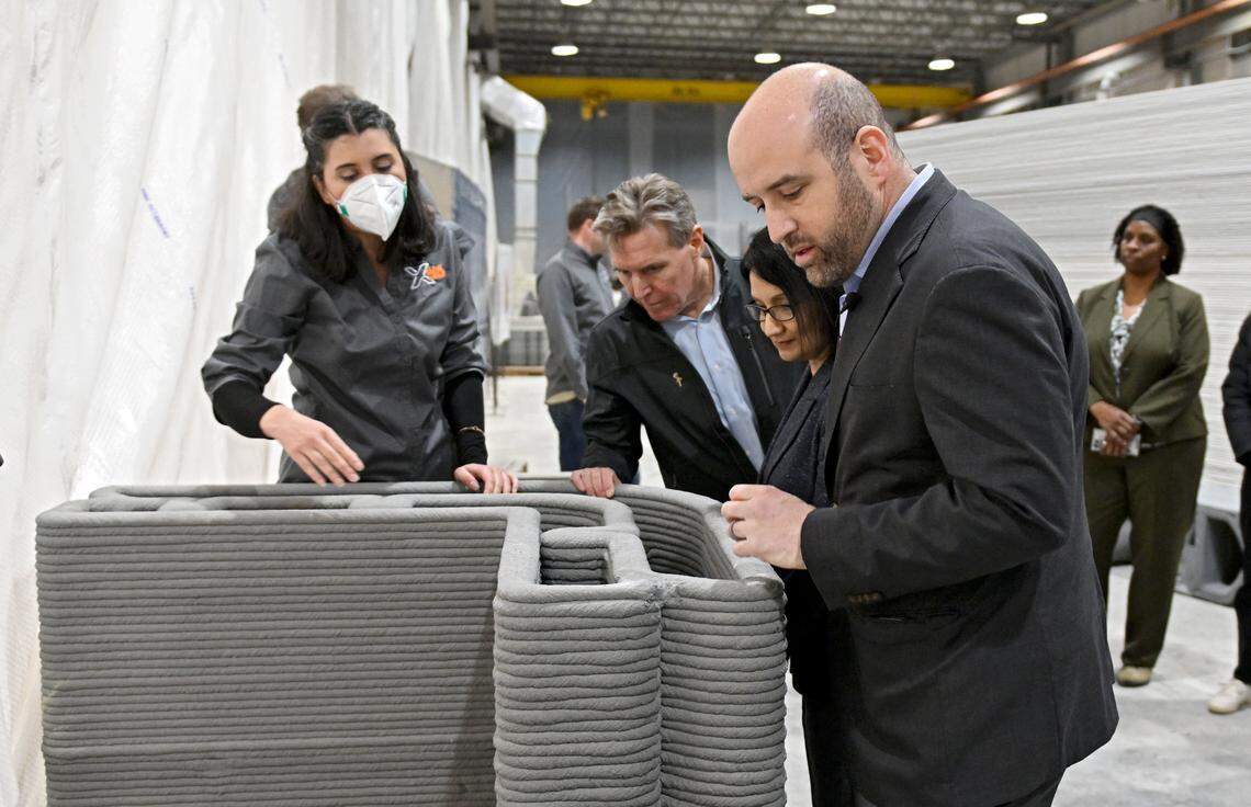 Pennsylvania Department of Economic Development Secretary Rick Siger listens to X-Hab 3D Director of Design Automation Paniz Farrokhsiar explain of the features and design of 3D printed concrete on Thursday, March 5, 2026. 