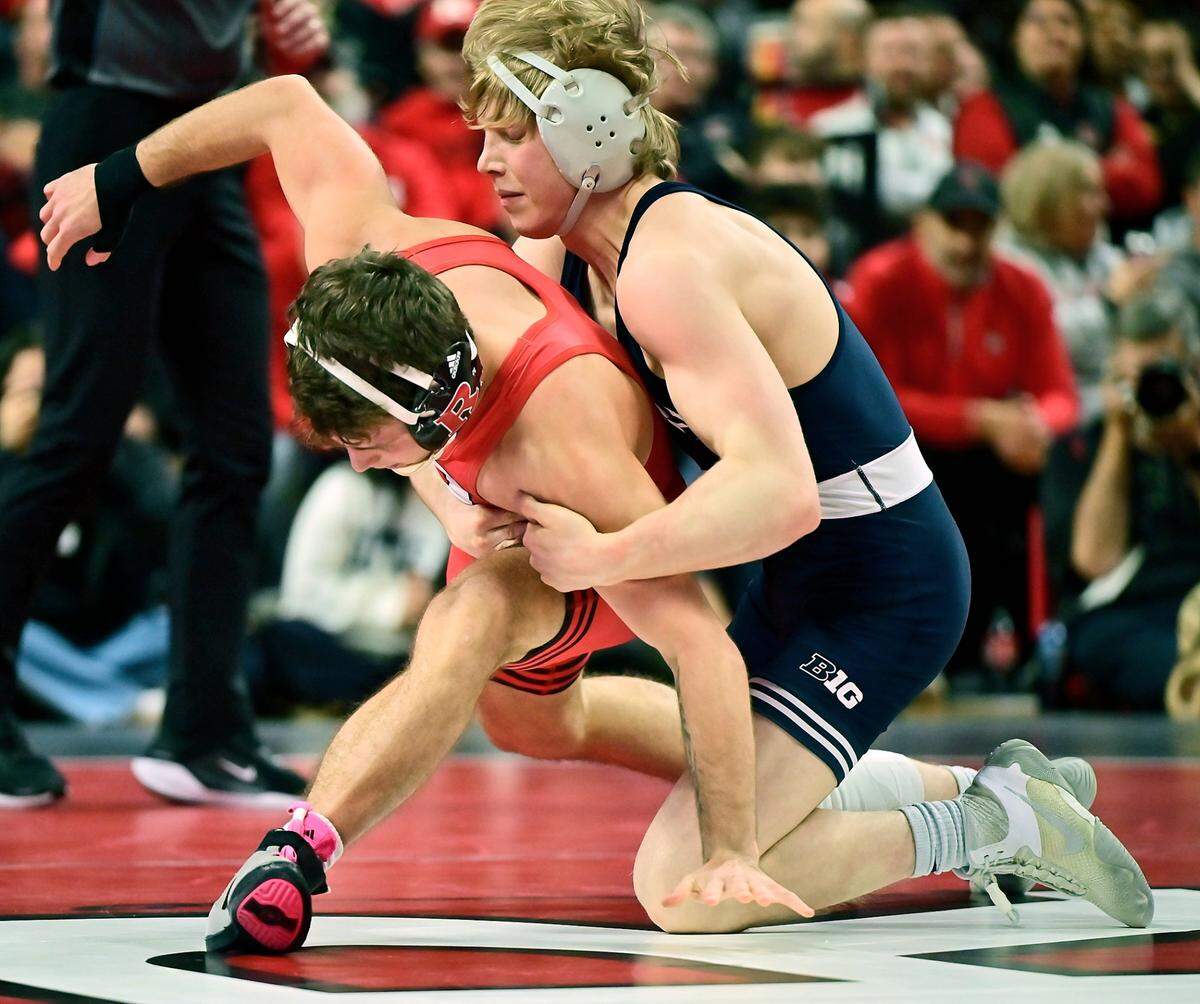 Penn State’s Braeden Davis aims to keep Rutgers’ Dylan Shawver from escaping in their 133-pound bout of the Nittany Lions’ 35-3 win on Friday in Piscataway, NJ. Davis edged Shawver, 2-1, in a battle of reigning Big Ten champions.