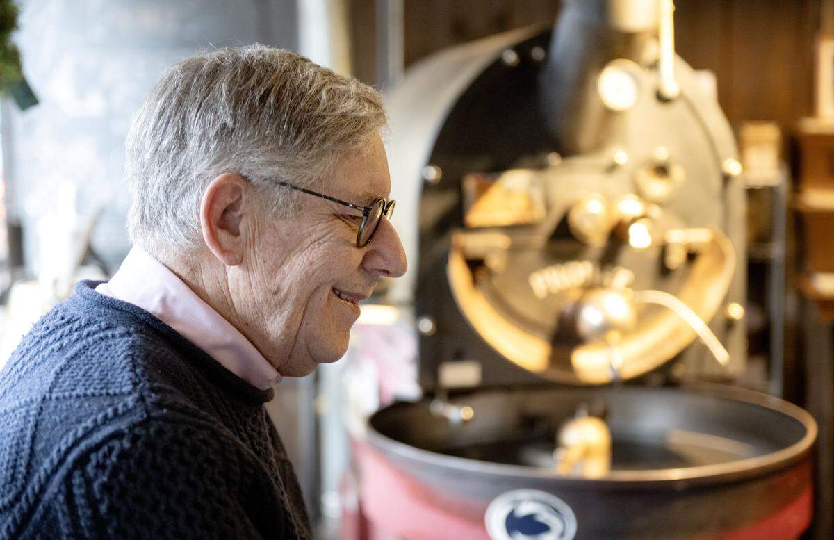 Bill Clarke talks with customers as he roasts coffee beans at The Cheese Shoppe on Wednesday, March 4, 2026. 
