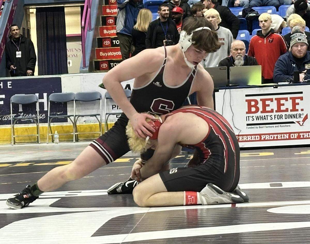 State College’s Teag Sanderson attempt to fight off a shot from Boyertown’s JD Heiser in their 172-pound bout on Saturday, Feb. 7, 2026 in 1st Summit Arena in Johnstown at the consolation quarterfinals of the PIAA Class 3A Team Wrestling Championships. Sanderson recorded a 14-1 major decision, but the Little Lions lost overall 29-27.