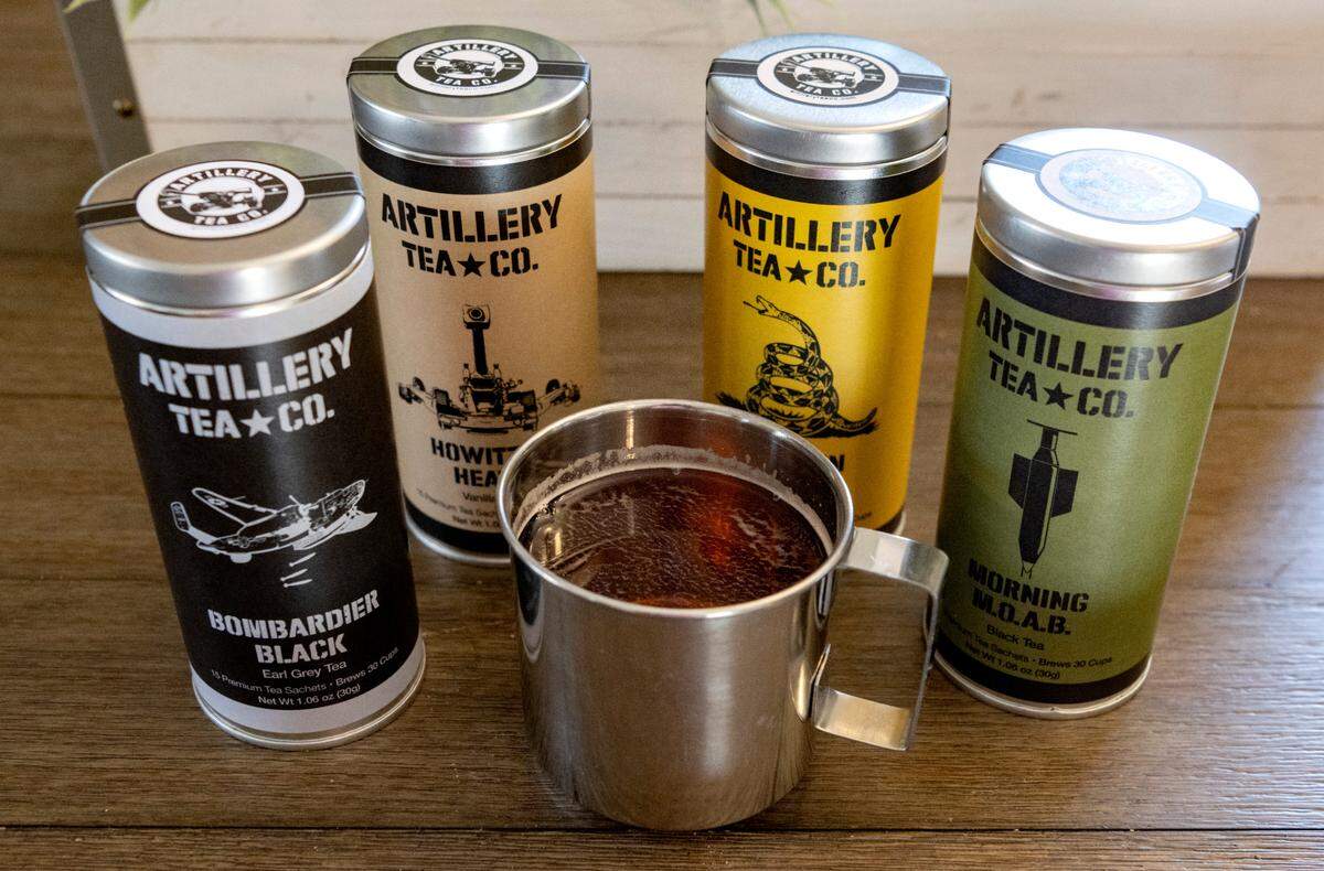 A mug of Bombardier Black is pictured among the products from Artillery Tea Co..