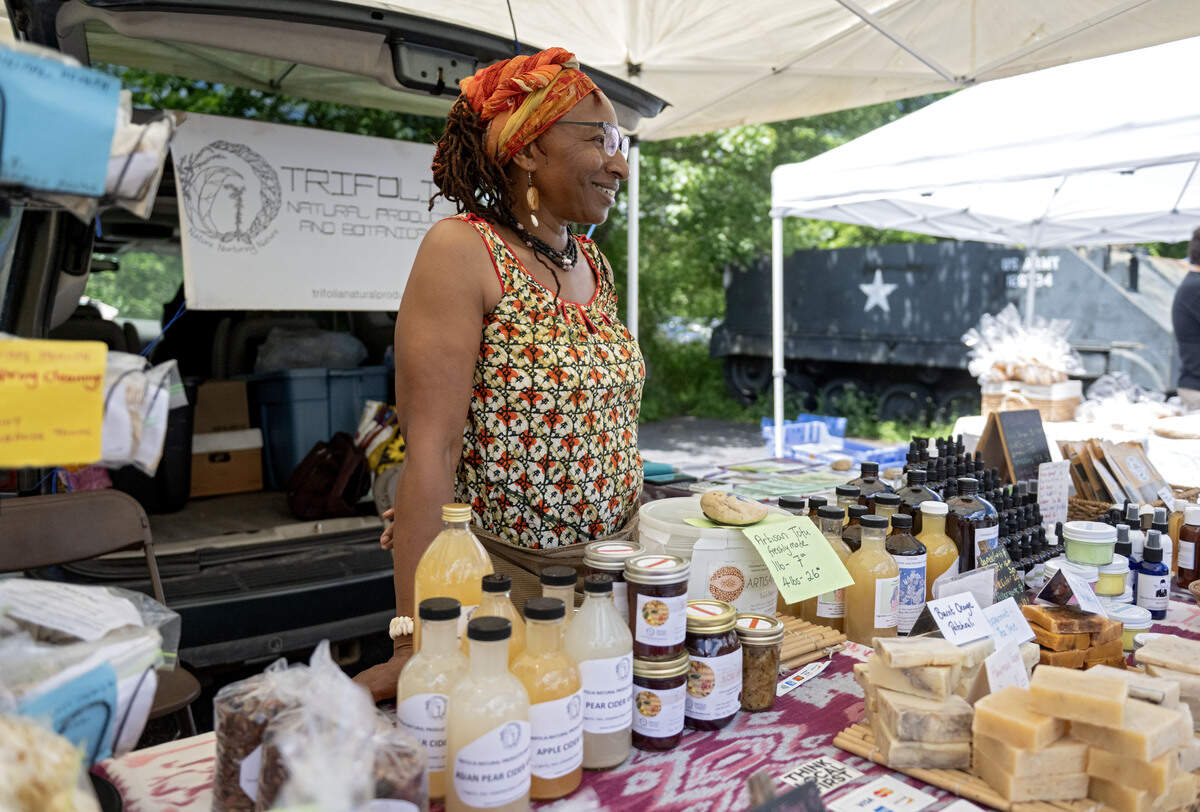 Yasoda Mensah chats with customers at her stand Trifolia Natural Products and Botanicals at the Boalsburg Farmers Market on Tuesday, June 23, 2026.