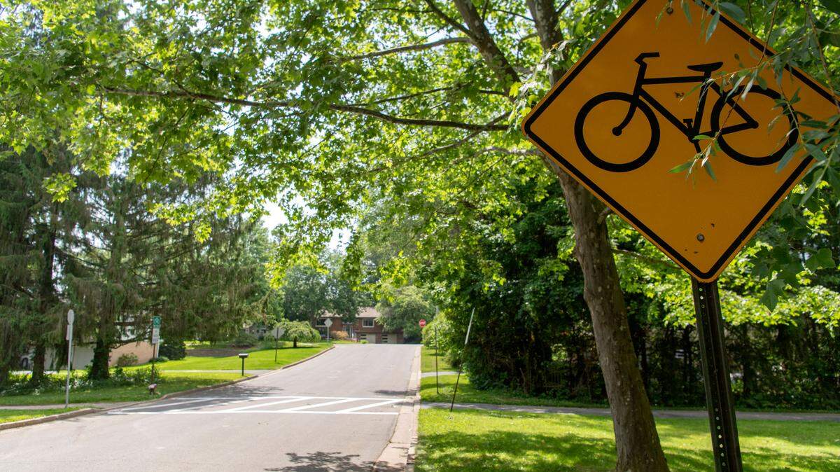 Signage for the bike path that crosses Edgewood Circle is pictured on Thursday, June 16, 2022.