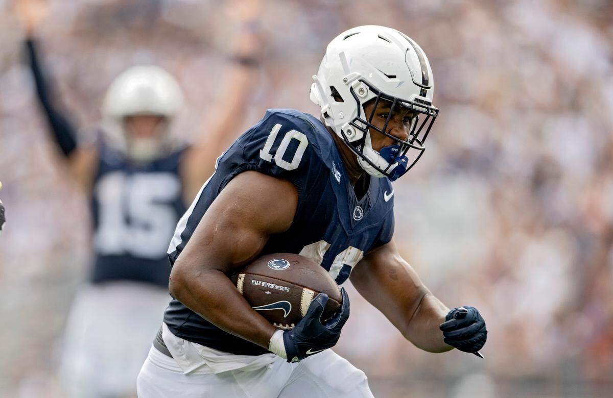 Penn State running back Nick Singleton cuts down the field for a touchdown as Drew Allar starts to celebrate during the game against Delaware on Saturday, Sept. 9, 2023.