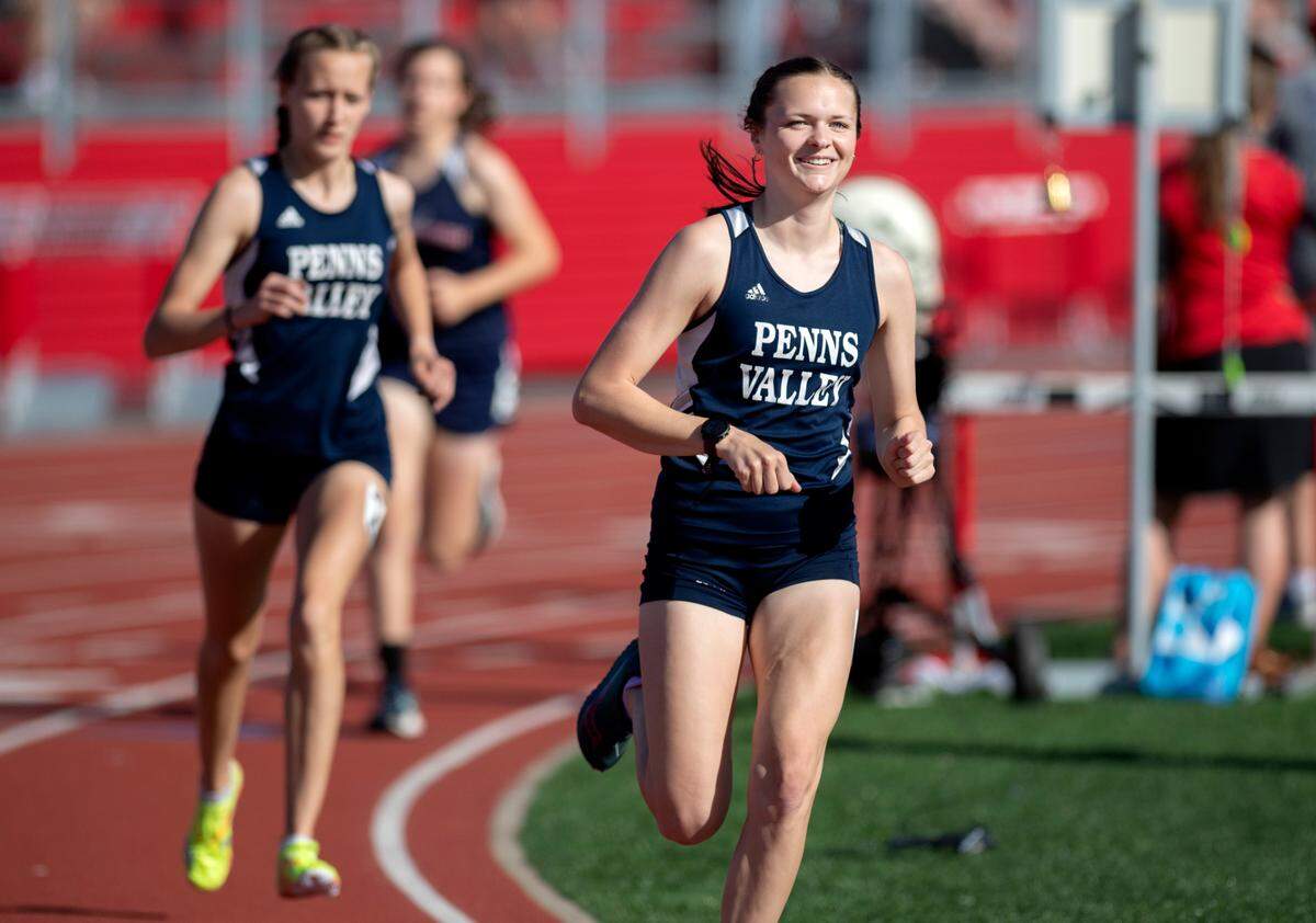 Penns Valley’s Anna Stitzer smiles as she runs the 1600 meter run during the Mountain League Track and Field championships on Tuesday, May 10, 2022. Stitzer finished in first with a time of 5:36.06.