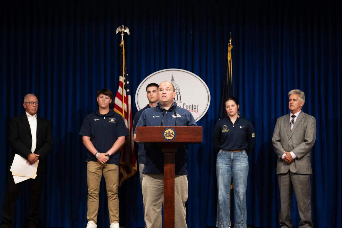 Bald Eagle Area’s Doug Dyke speaks during a press conference for with Rep. Scott Conklin about legislation that would allow public and private high schools to have separate playoffs for their sports teams.