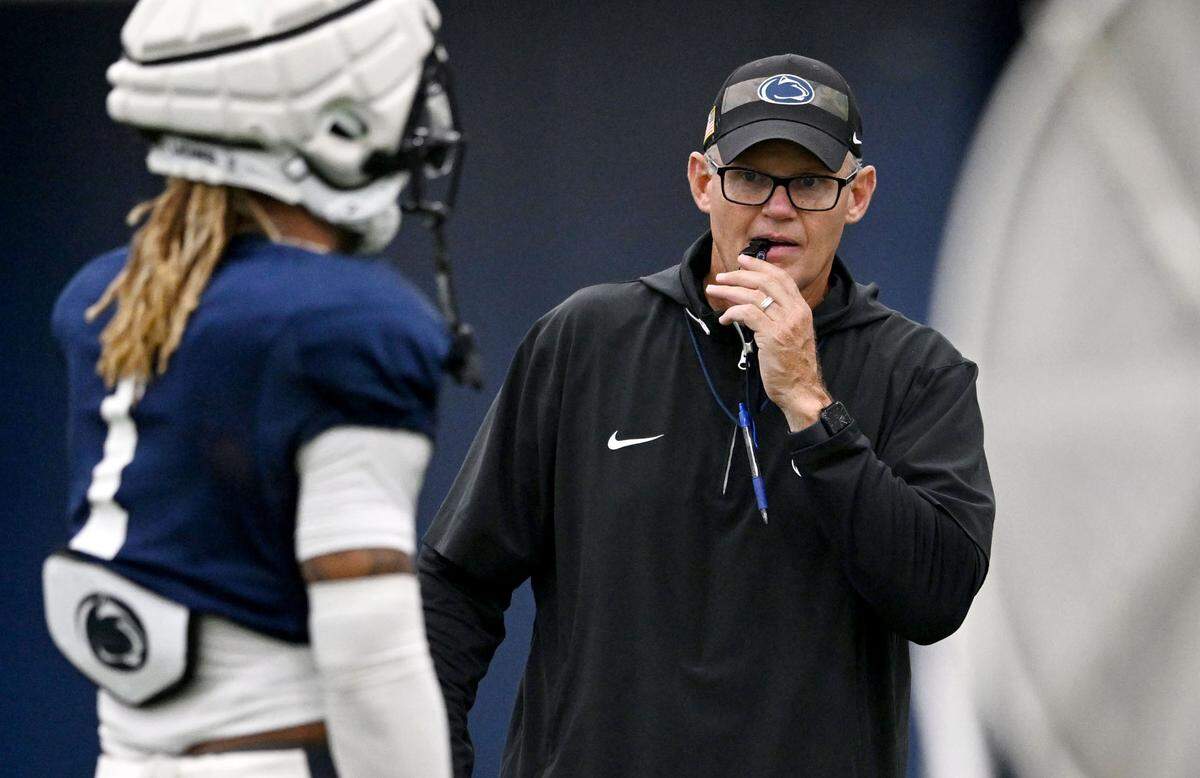 Penn State defensive coordinator Tom Allen talks to players as they line up for a drill at practice on Saturday, Aug. 3, 2024.