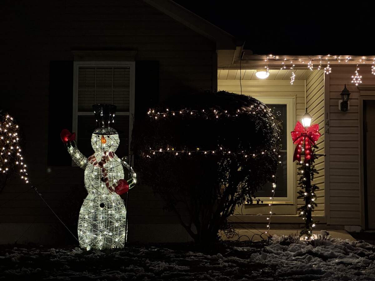 A snowman decoration stands outside 144 Steeplechase Drive, Pleasant Gap, on Dec. 4, 2025.