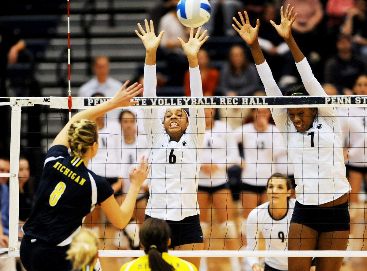 Penn State’s Alisha Glass (6) and Arielle Wilson (7) block the spike of Michigan’s Alex Hunt (8) during the Michigan at Penn State women’s volleyball Big Ten championship game Saturday, Nov. 28, 2009. CDT/Michelle Bixby