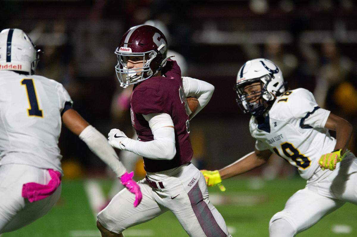 State High wide receiver Ty Salazer runs up field during the football game at Memorial Field on Friday, Oct. 4, 2024.