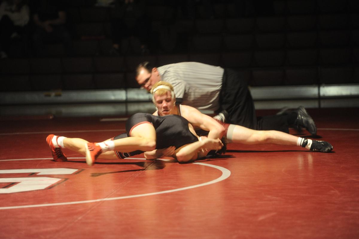 State College’s Pierson Manville looks for the pin of Cumberland Valley’s Jake Mitchell in their 139-pound match of the Little Lions’ 40-29 loss on Wednesday, January 11, 2023. Manville did pin Mitchell in 3:10.