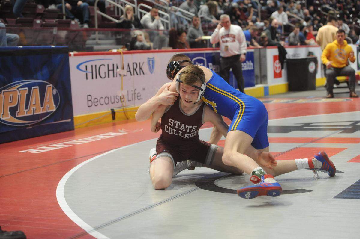 State College’s Asher Cunningham looks to finish off a takedown against Canon-McMillan’s Jacob Houpt in their 120-pound second round match of the PIAA Class 3A Championships on Thursday, March 10, 2022 at Giant Center in Hershey. Houpt scored late to beat Cunningham, 8-5.