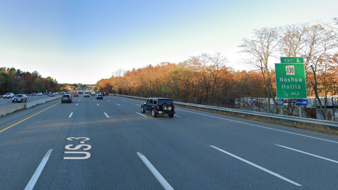 The driver was hanging out of his vehicle when he was pulled over south of Exit 6 in Nashua, New Hampshire, officials said.