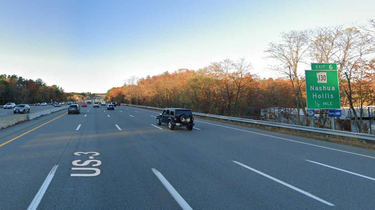The driver was hanging out of his vehicle when he was pulled over south of Exit 6 in Nashua, New Hampshire, officials said.