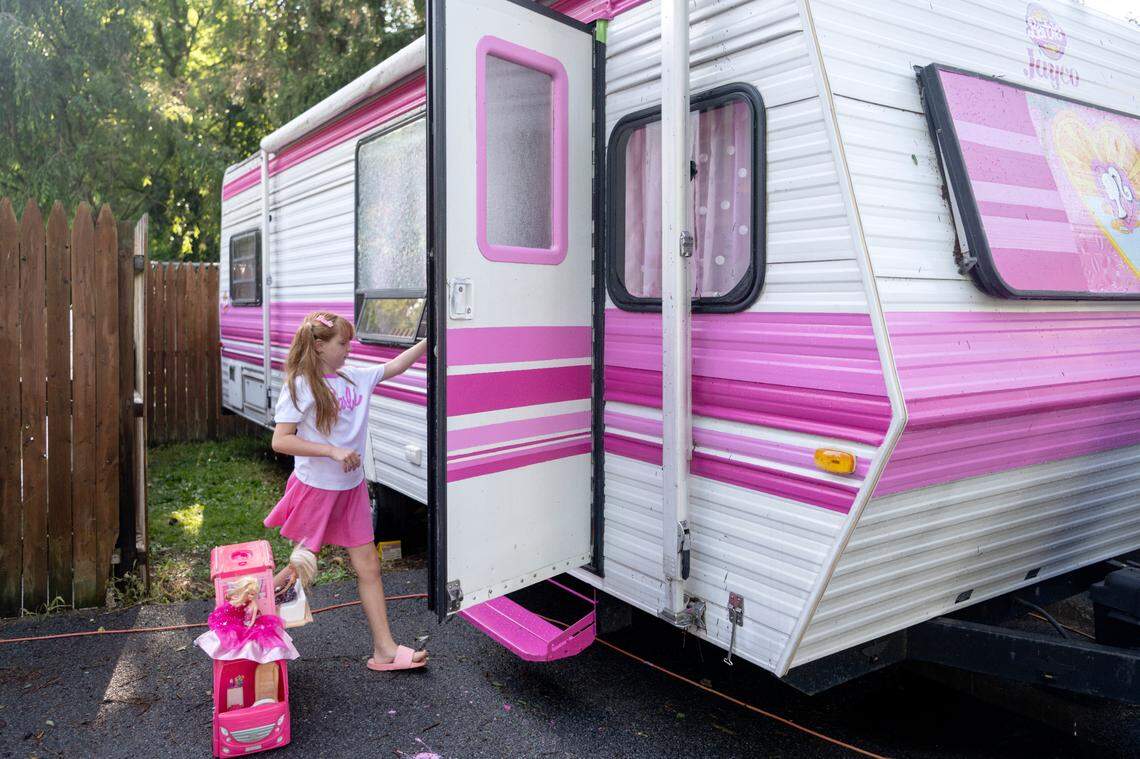 Jazmyn “Jazzy” Krammes opens the door for her real life Barbie camper on Friday, July 14, 2023.