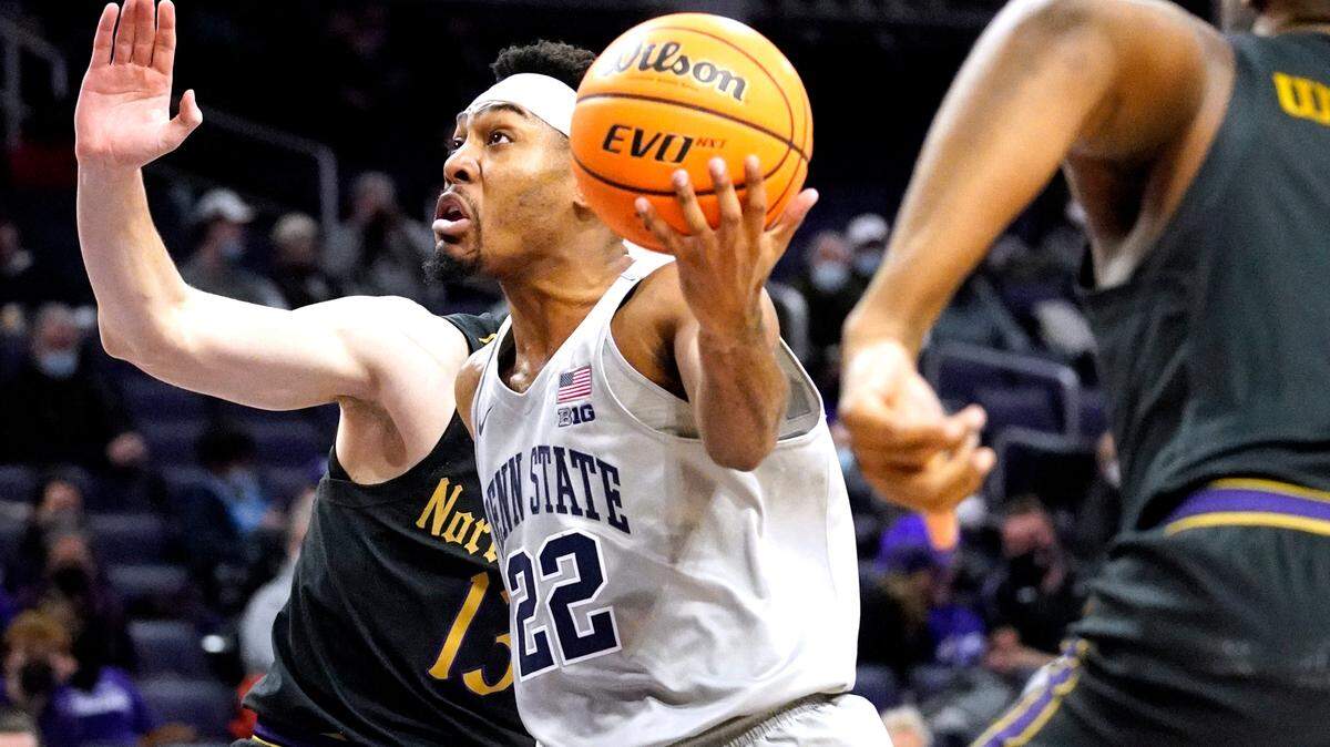 Penn State guard Jalen Pickett (22) drives to the basket against Northwestern guard Brooks Barnhizer, left, and forward Elyjah Williams during the first half of an NCAA college basketball game in Evanston, Ill., Wednesday, Jan. 5, 2022. (AP Photo/Nam Y. Huh)