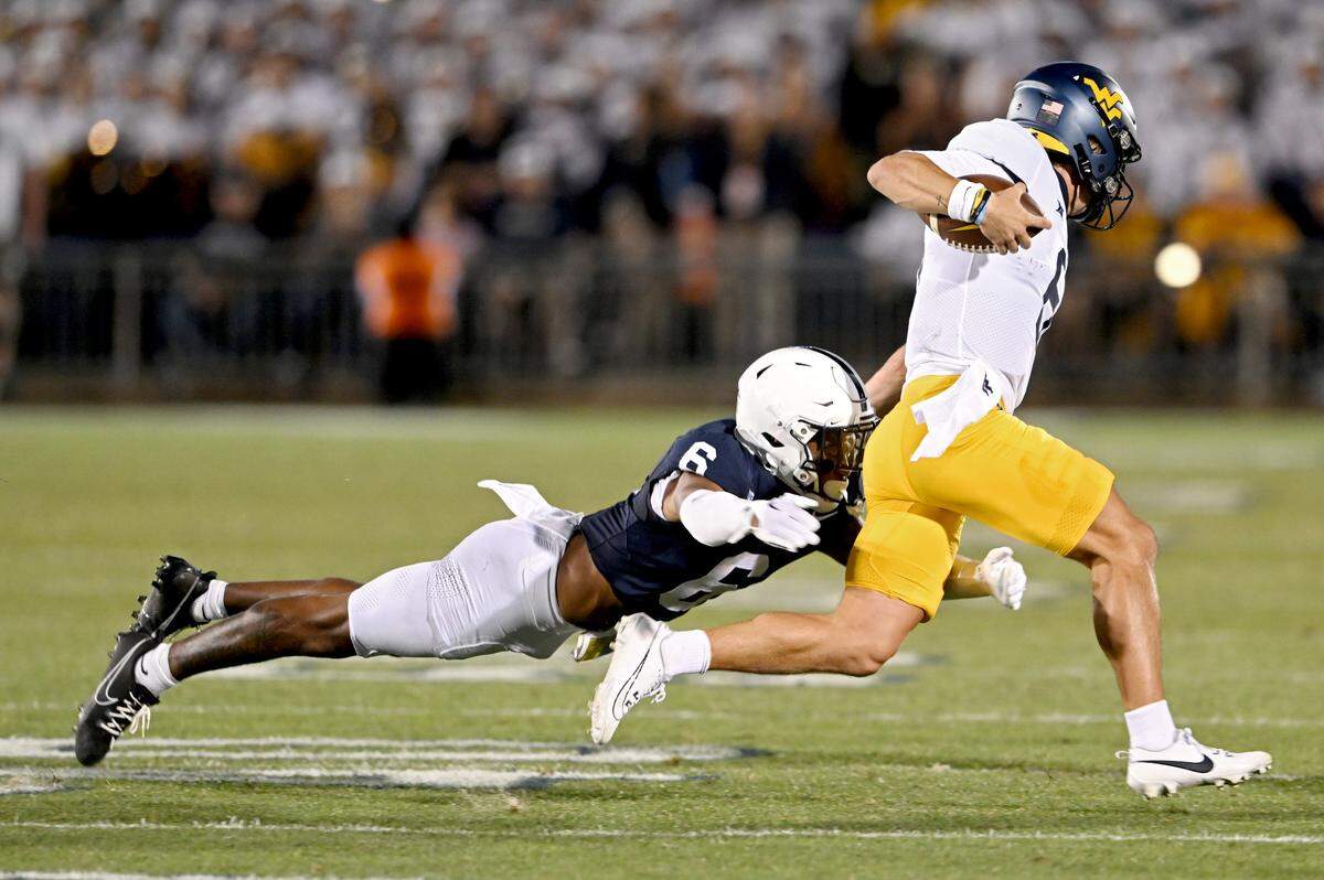 Penn State safety Zakee Wheatley stops West Virginia’s Garrett Greene during the game on Saturday, Sept. 2, 2023.