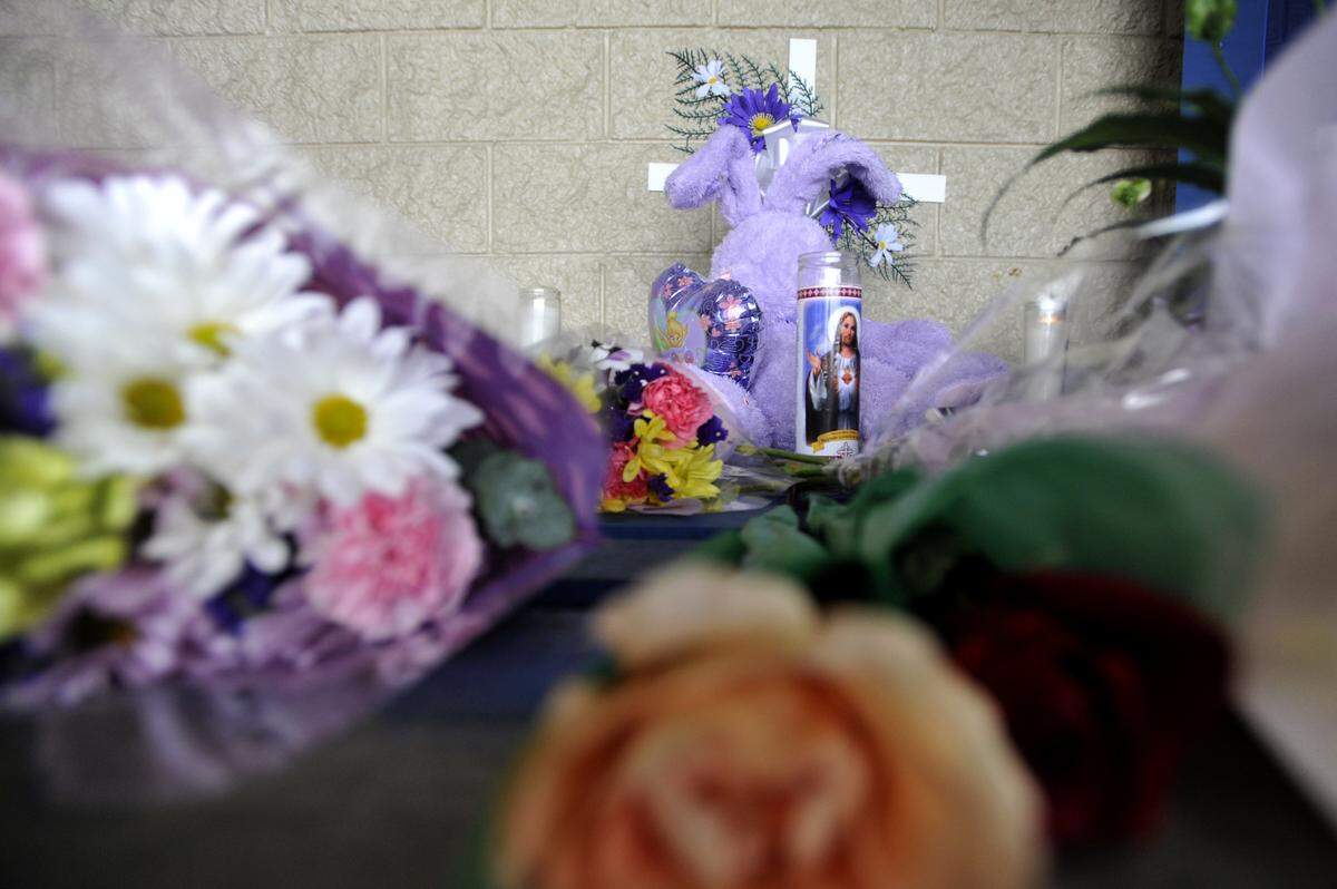A memorial was set up outside of the County Market in Philipsburg for Traci Raymond Miscavish after the woman was killed there in 2013.