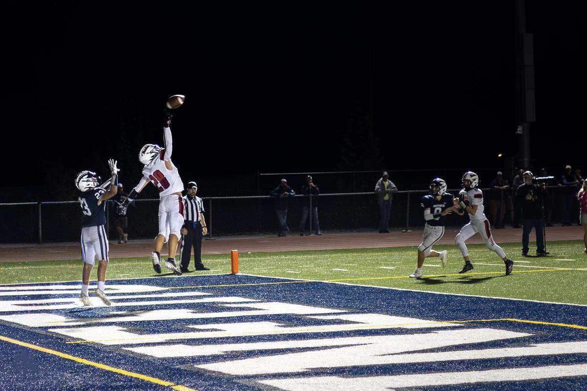 Bellefonte safety Jackson Long (28) jumps for a ball during the high school football game against Philipsburg-Osceola on Friday, Oct. 3, 2025, in Philipsburg, Pa. The Red Raiders beat the Mountaineers 24-15.