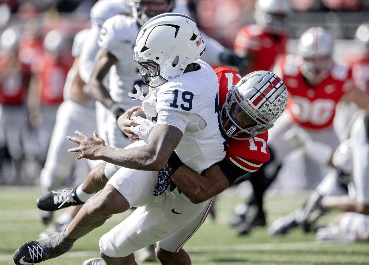 Ohio State’s Carnell Tate stops Penn State defensive end Chaz Coleman after he recovered the ball during the game on Saturday, Nov. 1, 2025. The defense forced one turnover but also allowed more than 450 yards of offense.