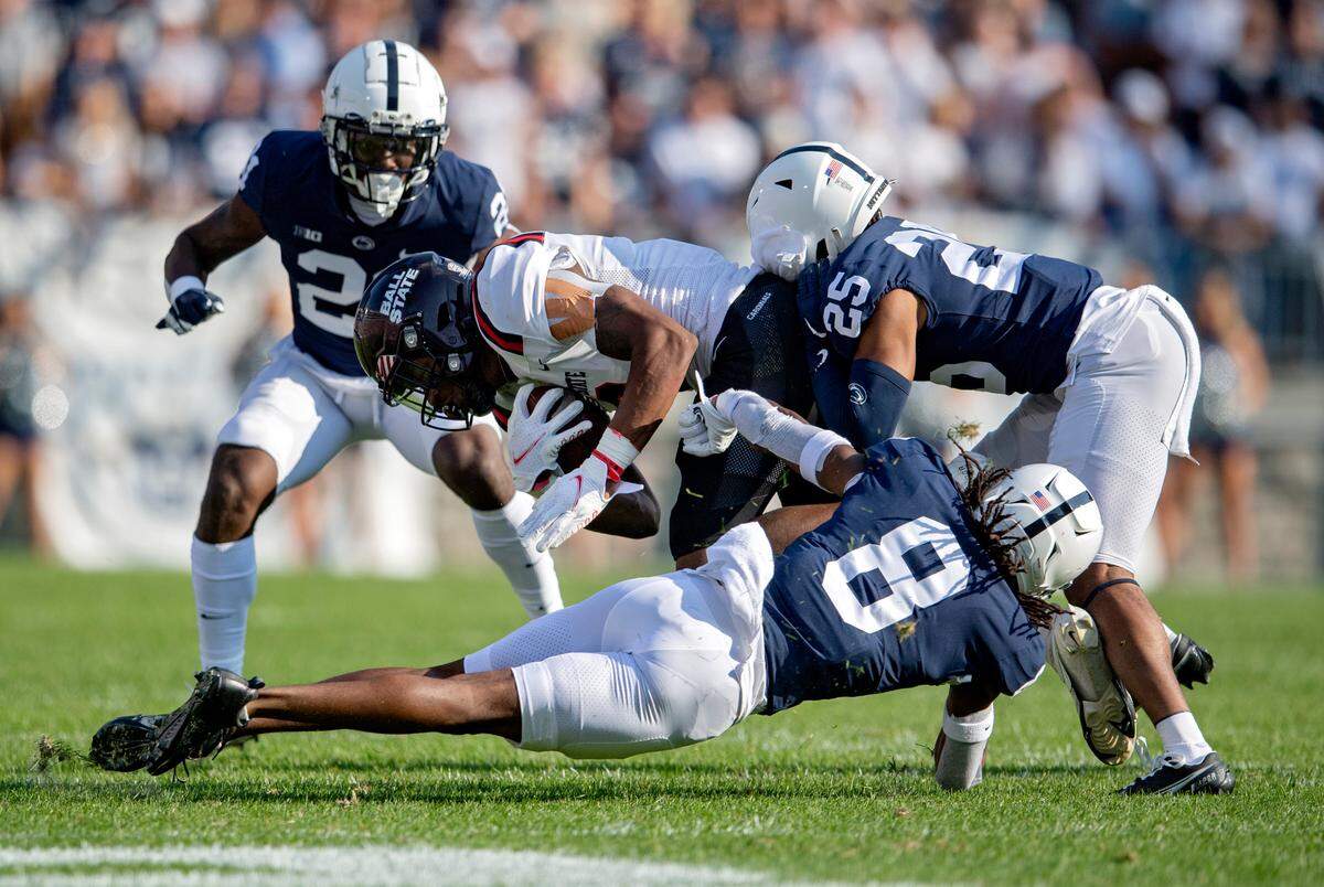 Penn State’s Marquis Wilson and Daequan Hardy stop Ball State ball carrier during the game on Saturday, Sept. 11, 2021.
