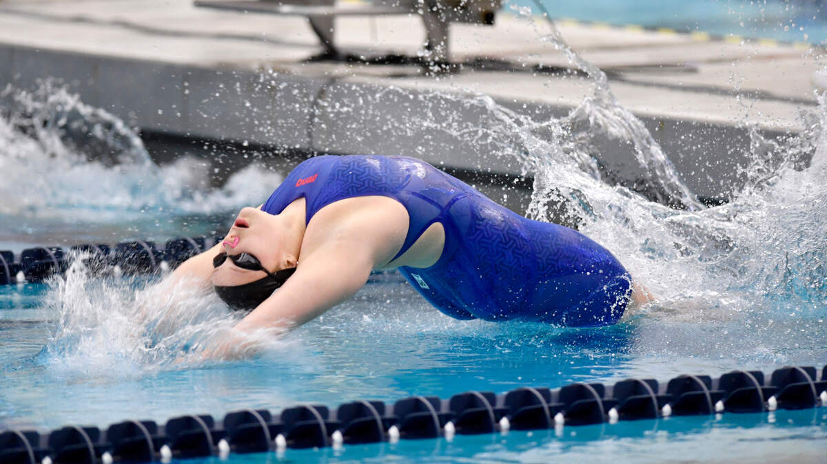 State College’s Jade Castro competes in the 100 yard backstroke finals during the PIAA swimming championships at Bucknell on Thursday. Castro finished in second with a time of 54:33.