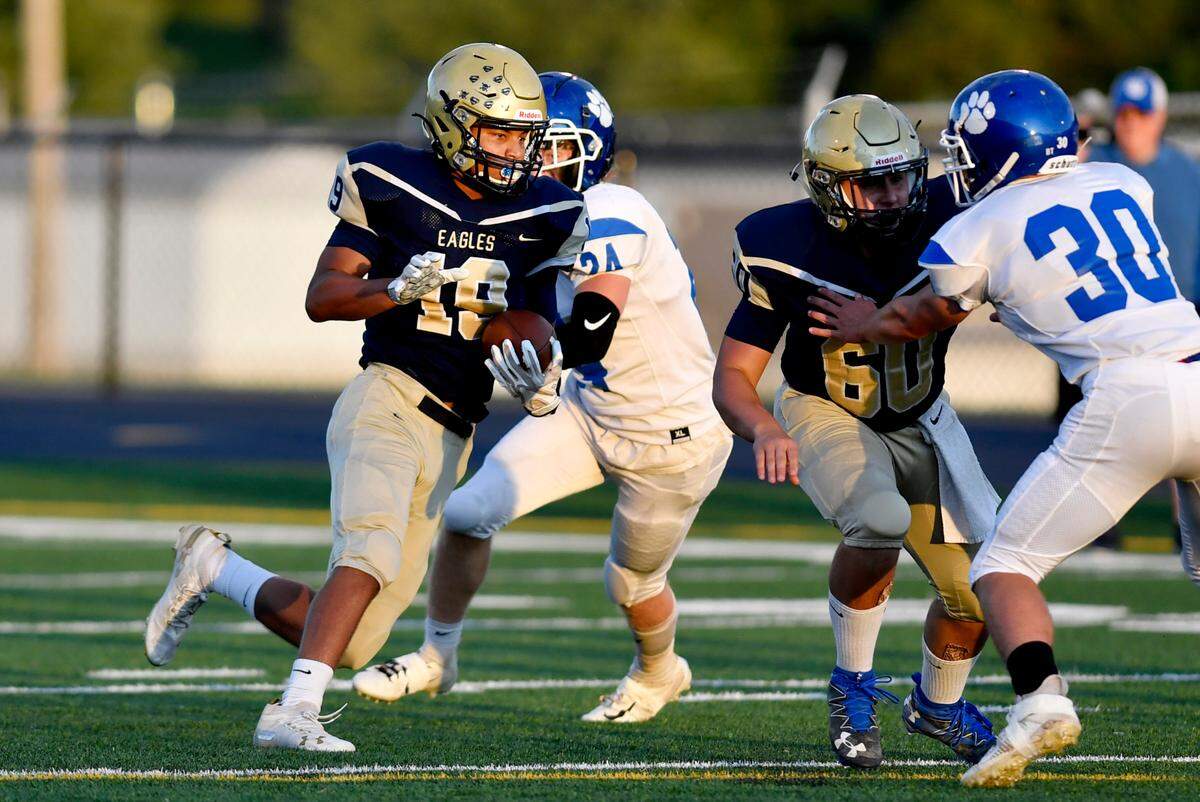 Bald Eagle Area’s Cam Watkins cuts down the field with the ball and and scores a touchdown during the game against North Penn-Mansfield on Friday, Sept. 10, 2021.