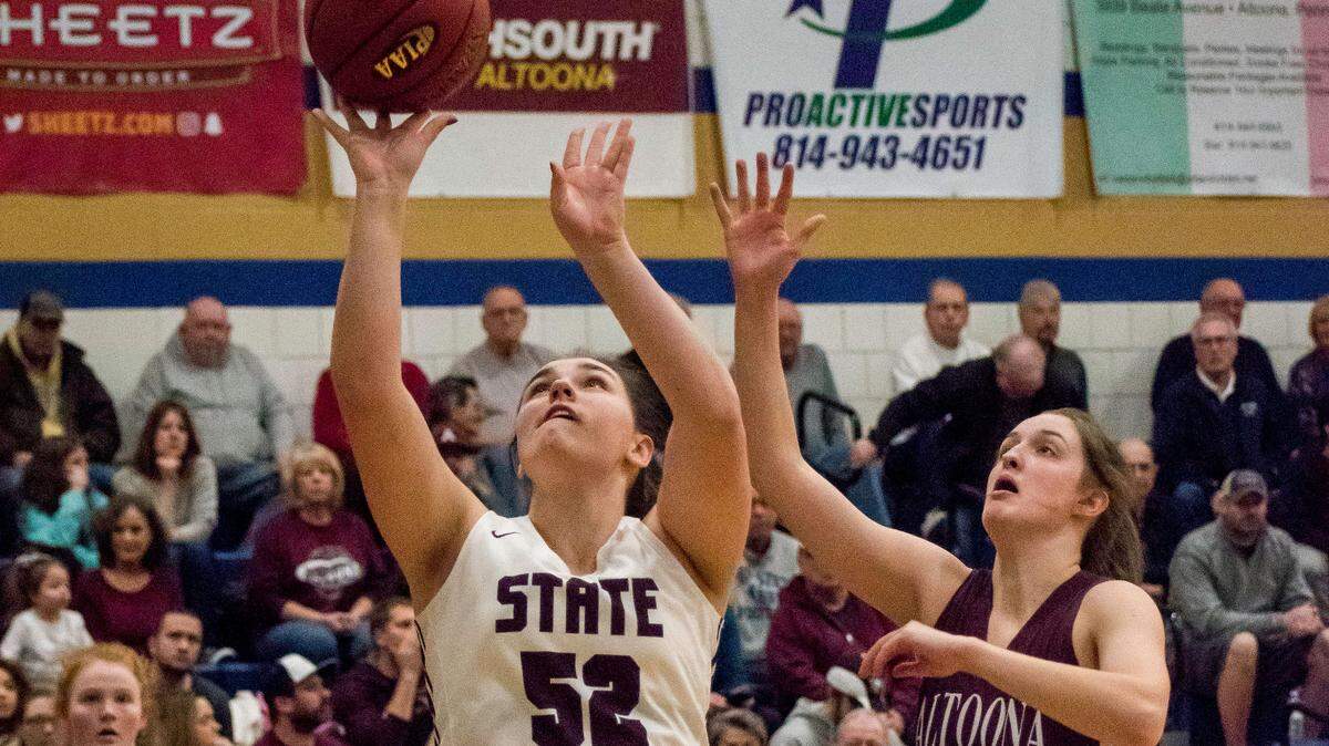 State College’s Caitlyn Brannon gives the Lady Little Lions their first points Thursday night during the District 6 Class 6A championship against Altoona in Hollidaysburg.. Altoona won 50-38.