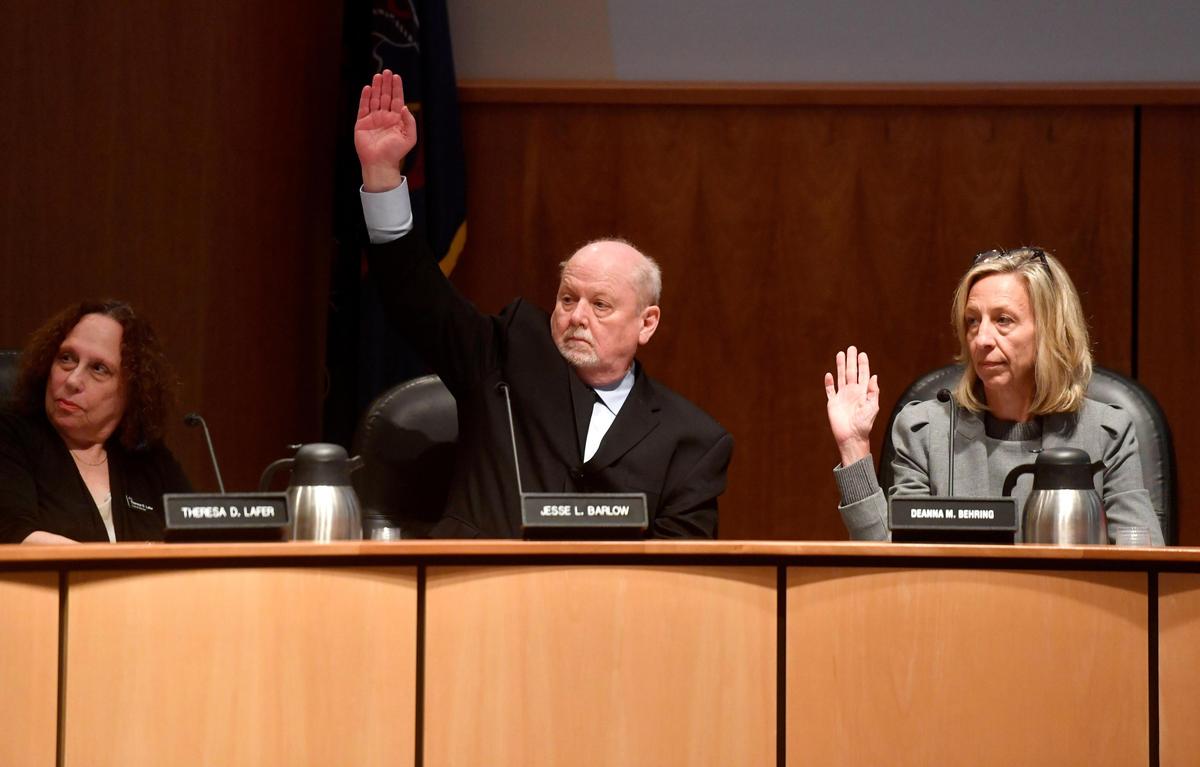 Jesse Barlow votes for himself to be president of the State College Borough Council during the meeting on Monday. Barlow won by a vote of 5-2.