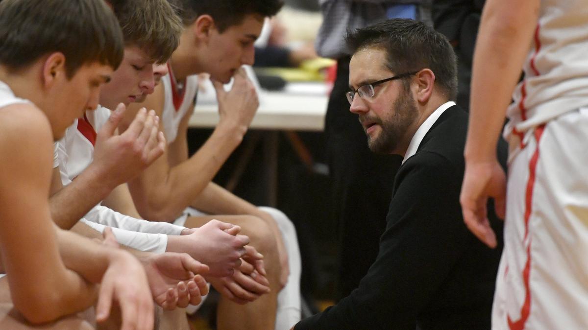 Bellefonte boys basketball coach Kris Glunt talks to his players before overtime of the the District 6 5A semi-final game against Hollidaysburg on Tuesday, Feb. 19, 2019.