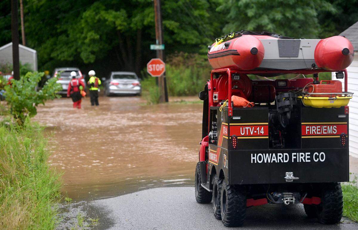 Howard Fire Company performs a specialized rescue for residents of a home on Buttonwood Street in Unionville as Dewitt Run floods on Friday, August. 9, 2024.