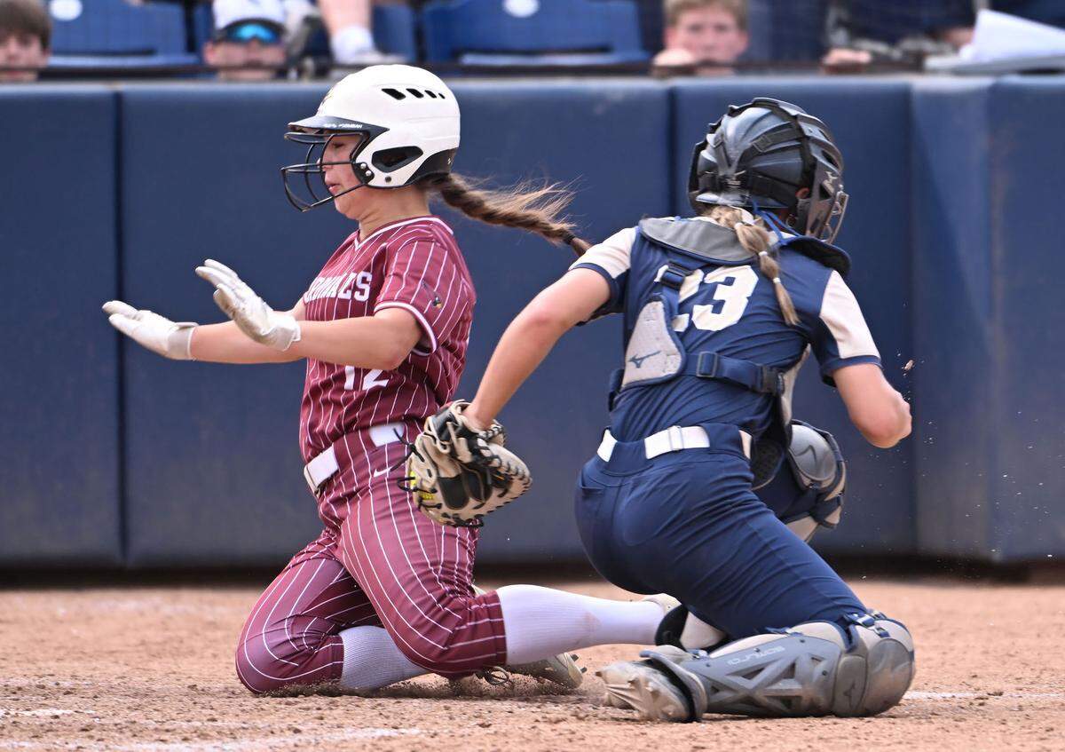 Bald Eagle Area catcher Kailey Eckert tags out Pine Grove Area third runner Nicole Morgan at the plate during Friday’s 2025 PIAA Championship game. Pine Grove defeated BEA, 4-3, in 13 innings at Beard Field in State College.