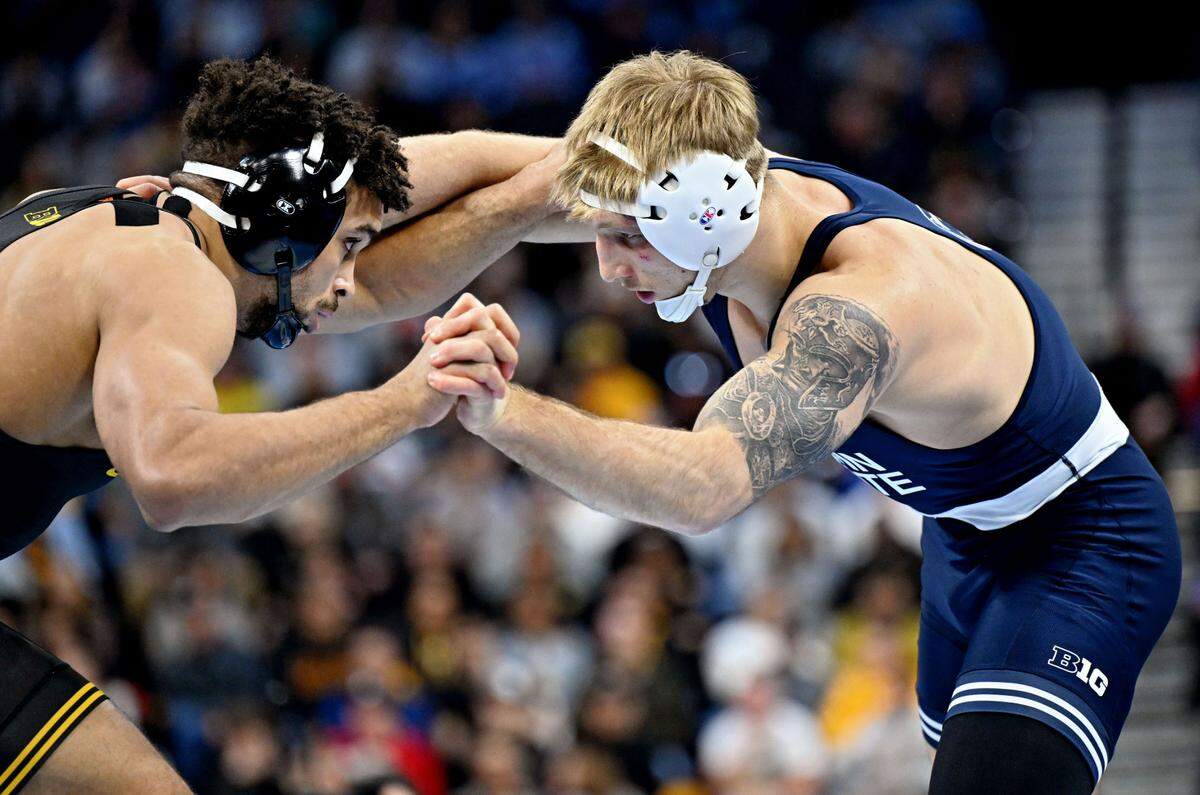 Iowa’s Stephen Buchanan and Penn State’s Josh Barr face off in the 197-pound championship bout of the 2025 NCAA Wrestling Championships at the Wells Fargo Center in Philadelphia on Saturday, March 22, 2025.  