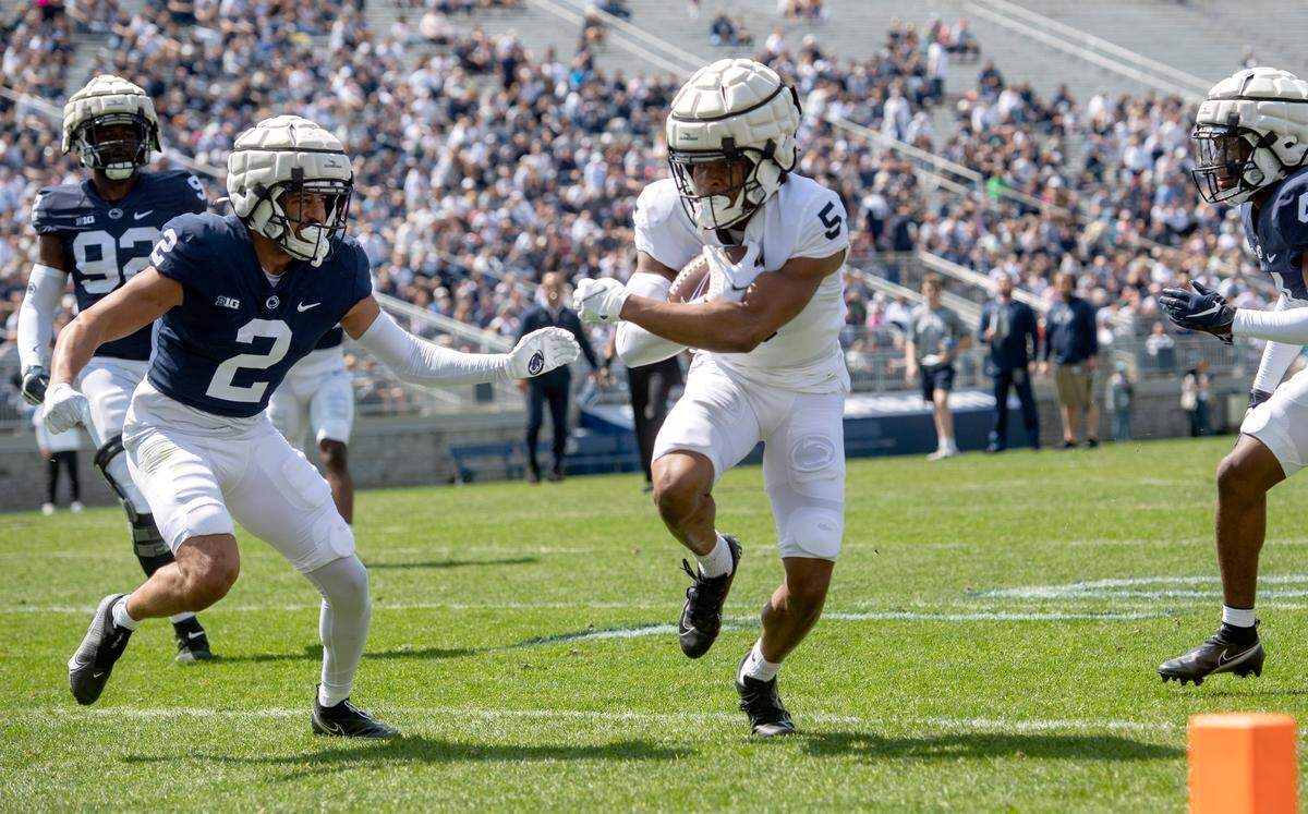 Penn State wide receiver Mitchell Tinsley cuts down the field with the ball during the Blue-White game on Saturday, April 23, 2022.