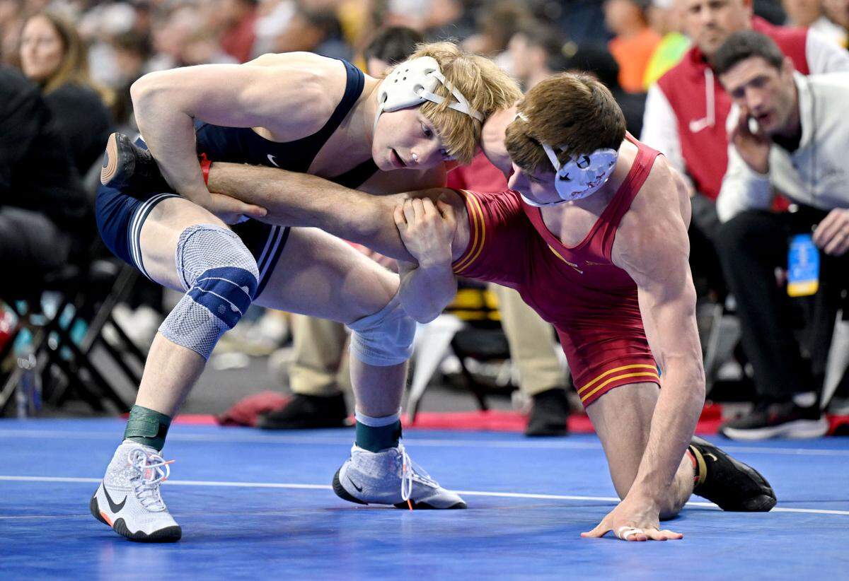 Penn State’s Braeden Davis wrestles Iowa State’s Evan Frost in a 133-pound at the 2025 NCAA Wrestling Championships in Philadelphia on Friday, March 21, 2025.