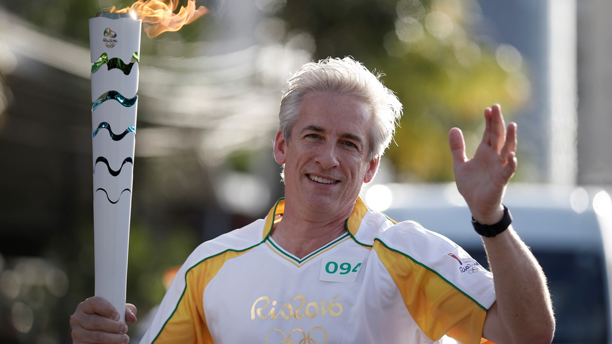 David Mazza, senior vice president and chief technical officer of NBC Sports and NBC Olympics, carries torch at the 2016 Summer Olympics in Rio de Janeiro, Brazil.