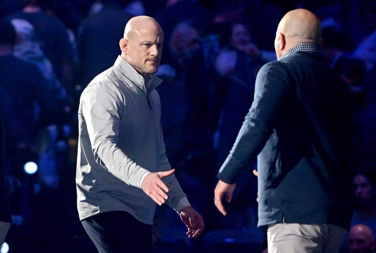Penn State wrestling coach Cael Sanderson shakes hands with Michigan coaches after the 39-0 win on Friday, Feb. 7, 2025 in the Bryce Jordan Center.