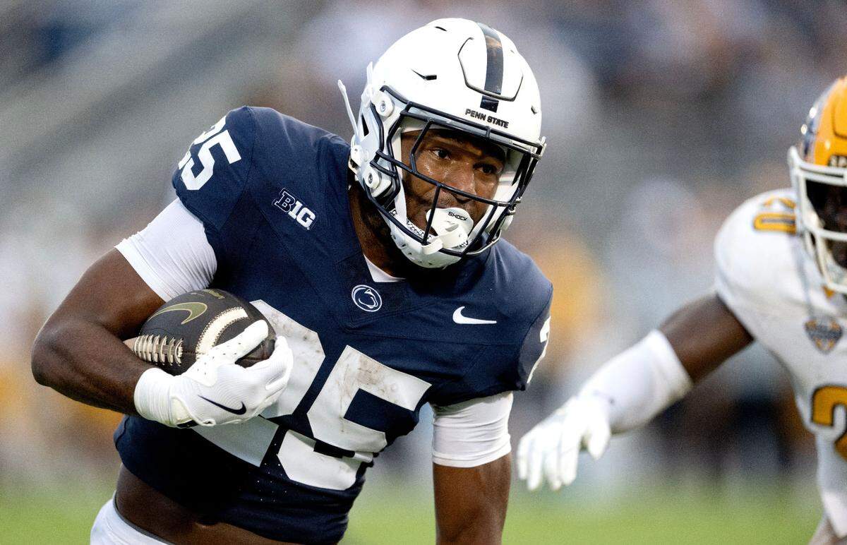 Penn State running back Quinton Martin Jr. cuts down the field with the ball from Kent State defenders during the game on Saturday, Sept. 21, 2024 at Beaver Stadium.