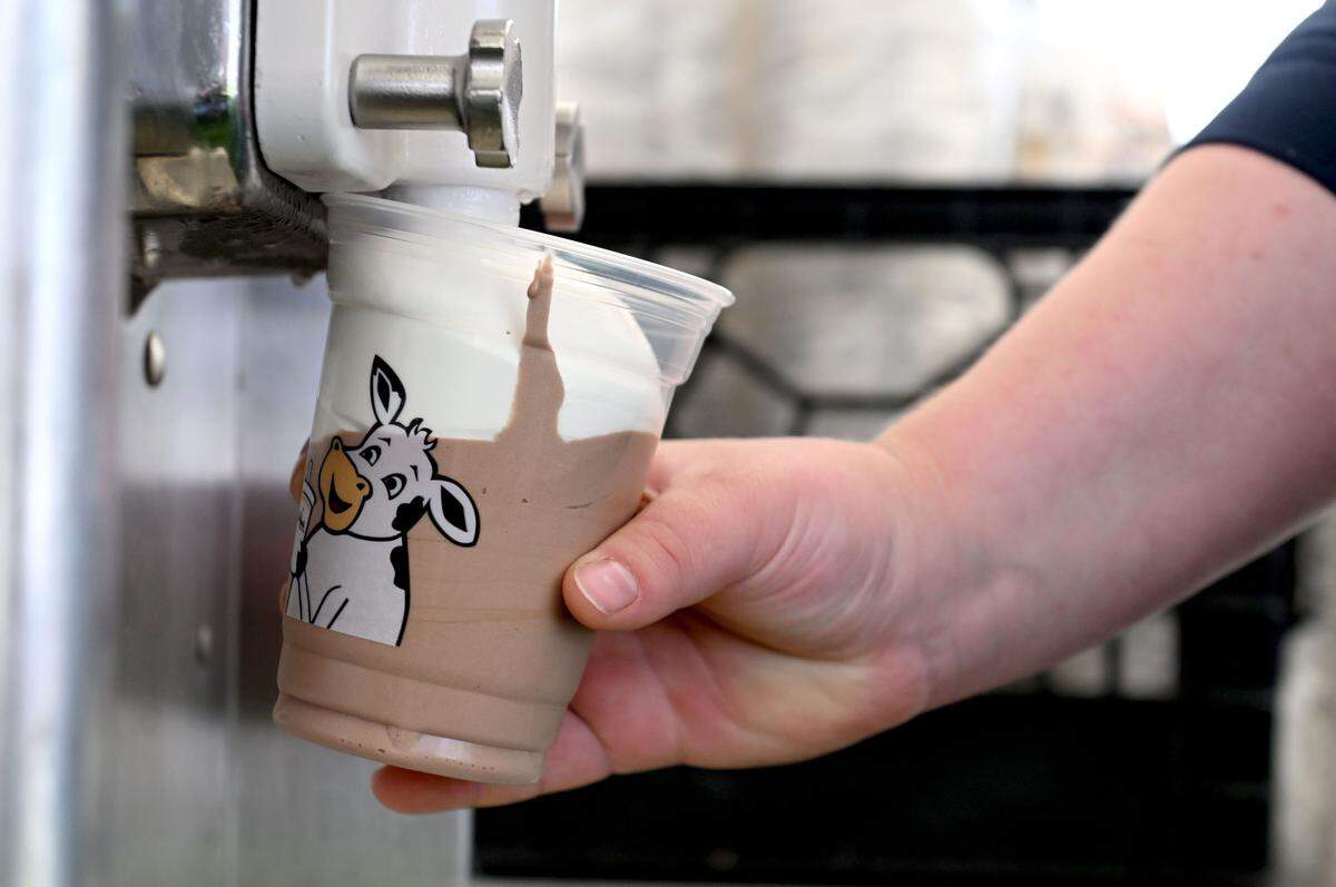 Volunteers from the Pennsylvania Jr. Guernsey Breeders Renee Elay makes a twist milkshake at Penn State Ag Progress Days on Tuesday, August. 13, 2024.