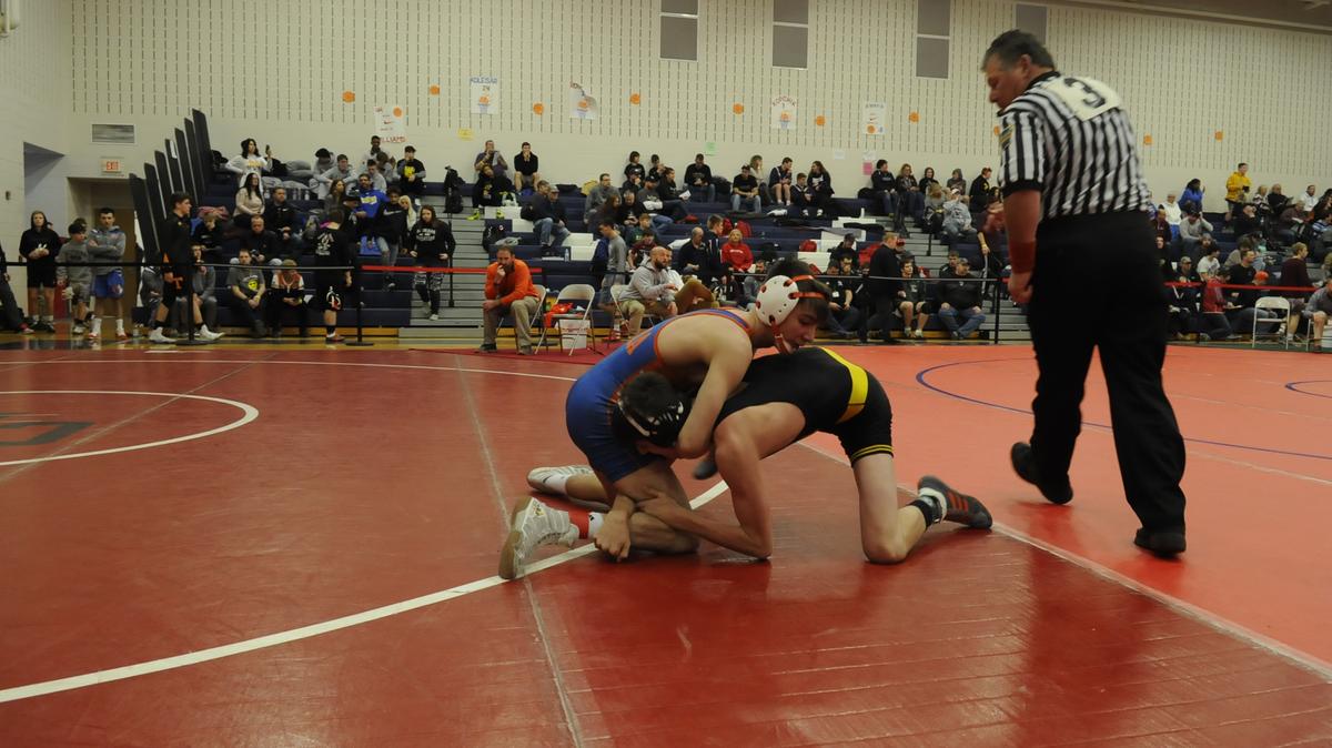St. Joseph’s Catholic Academy’s Amonn Ohl, left, is back on top of the falls leaderboard this week. Ohl, who led the county with 34 falls, pinned his way to an Ultimate Warrior title with 4 falls, and now has 22 on year.