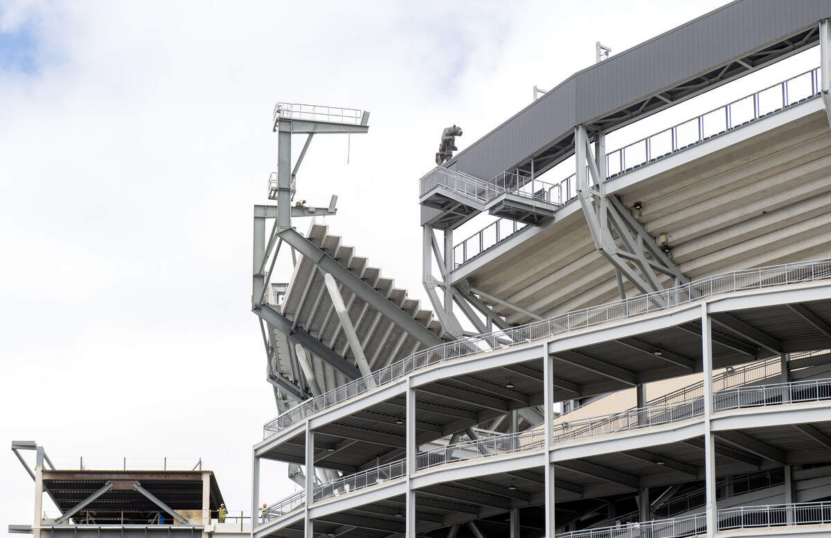 A construction worker is seen on the new portion of stands on the west side of Beaver Stadium showing that they are higher than the south stands on Monday, June 8, 2026.