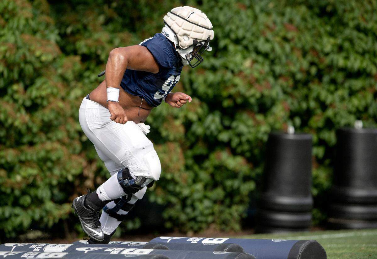 Penn State defensive tackle PJ Mustipher during a drill during practice on Wednesday, Aug. 10, 2022.