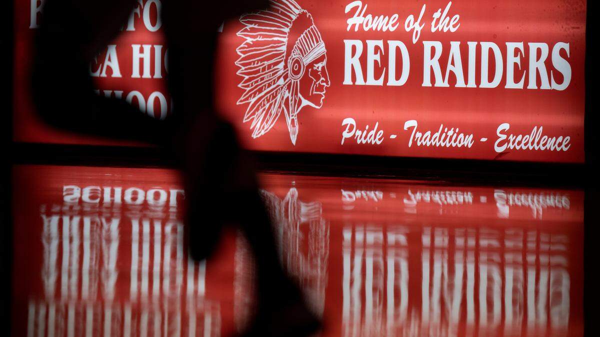 A player runs down the court in front of the Bellefonte Red Raiders sign during a girls basketball game on Jan. 28.