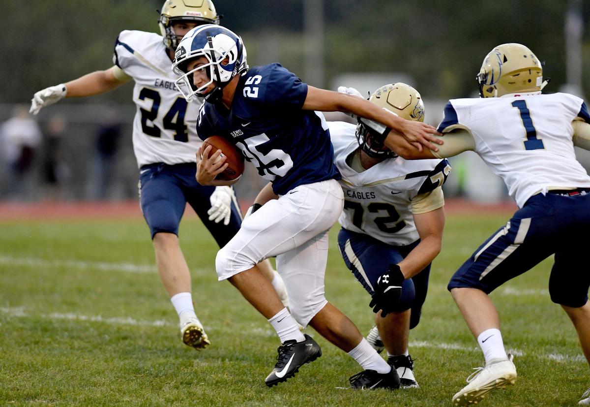 Penns Valley’s Gage Ripka runs with the ball from Bald Eagle area defenders during the game on Friday Sept. 6, 2019.  Penns Valley won, 47-7.