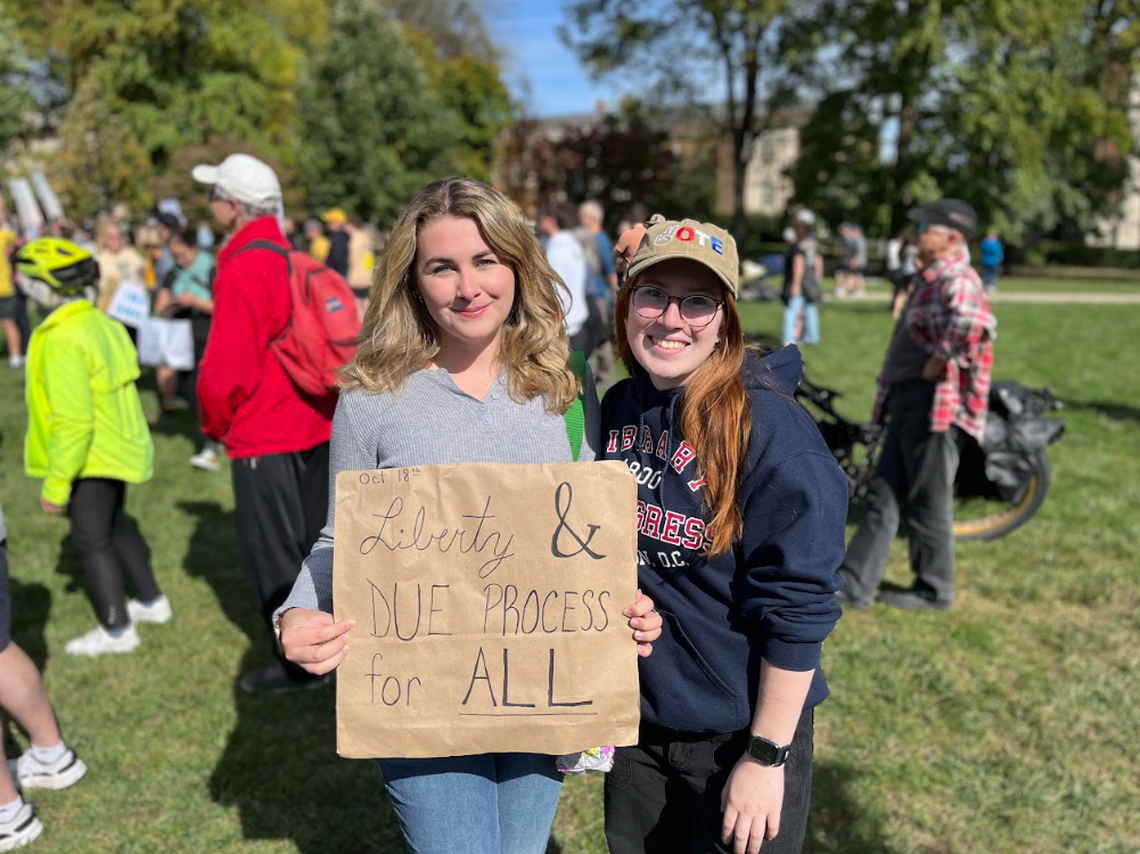 Penn State students Beyla Holer, left, and Isabel Rivera at Saturday’s No Kings protest, which was held in opposition of the actions taken by President Donald Trump and his administration. The event was one of more than 2,500 scheduled No Kings protests to take place across the country Saturday.