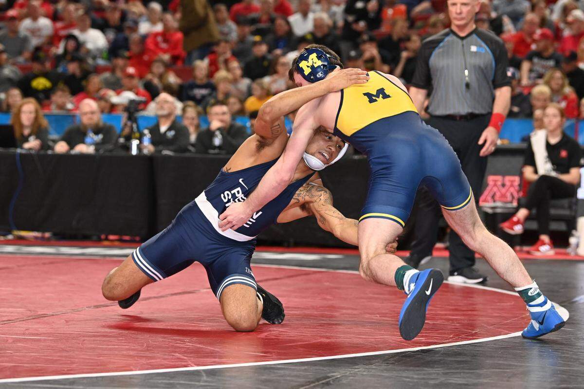 Penn State’s Roman Bravo-Young looks for takedown on Michigan’s Dylan Ragusin in their 133-pound semifinals match of the Big Ten Championships on Saturday, March 5, 2022 in Lincoln, Neb. Bravo-Young topped Ragusin 4-0 to make the finals.