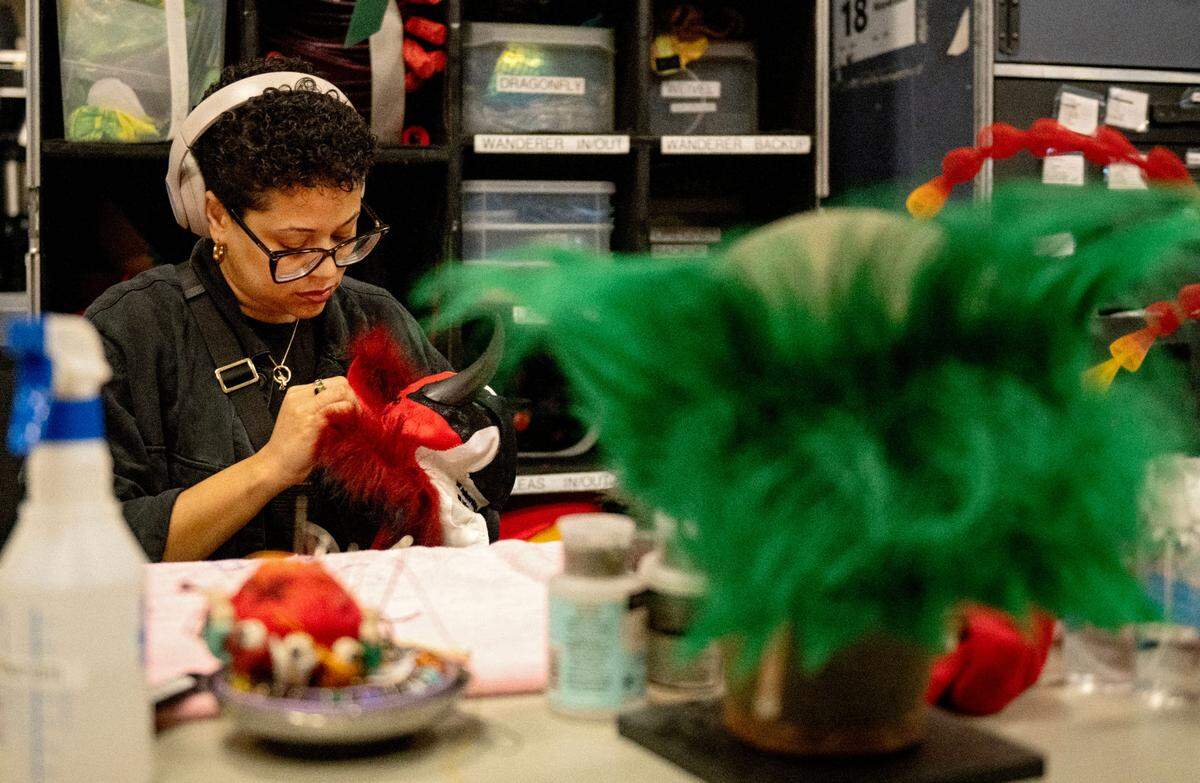 Wardrobe artist Mariah McDonald works on some of the costumes for “Ovo,” a Cirque du Soleil’s show, at the Bryce Jordan Center on Thursday, March 27, 2025.