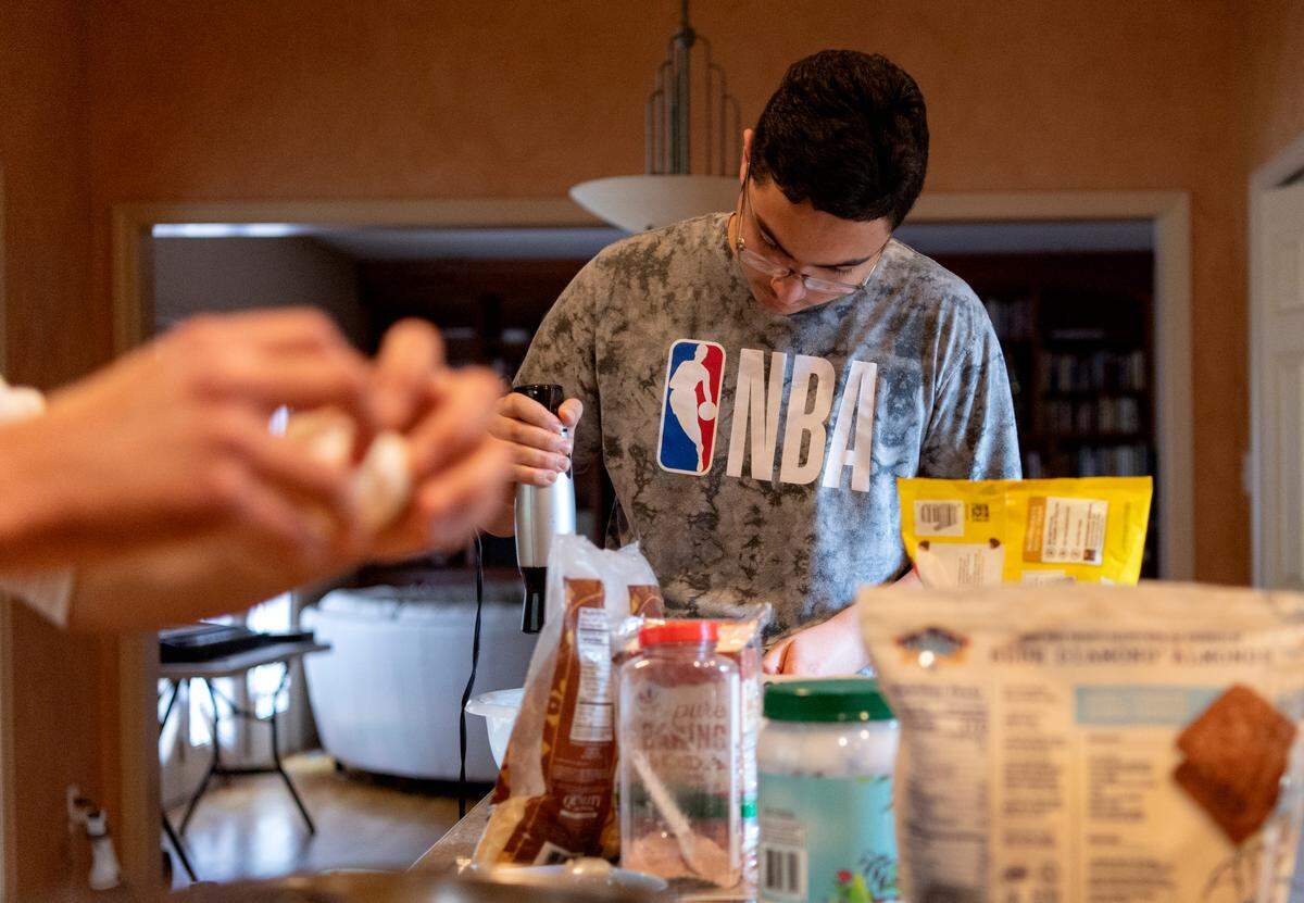 Omer Kurt mixes up a batch of almond flour chocolate chip cookies on July 23.