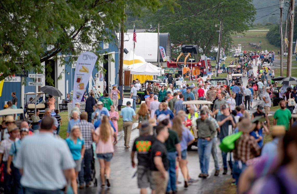 Visitors walk along the food stands at Ag Progress Days on Tuesday, Aug. 10, 2021.