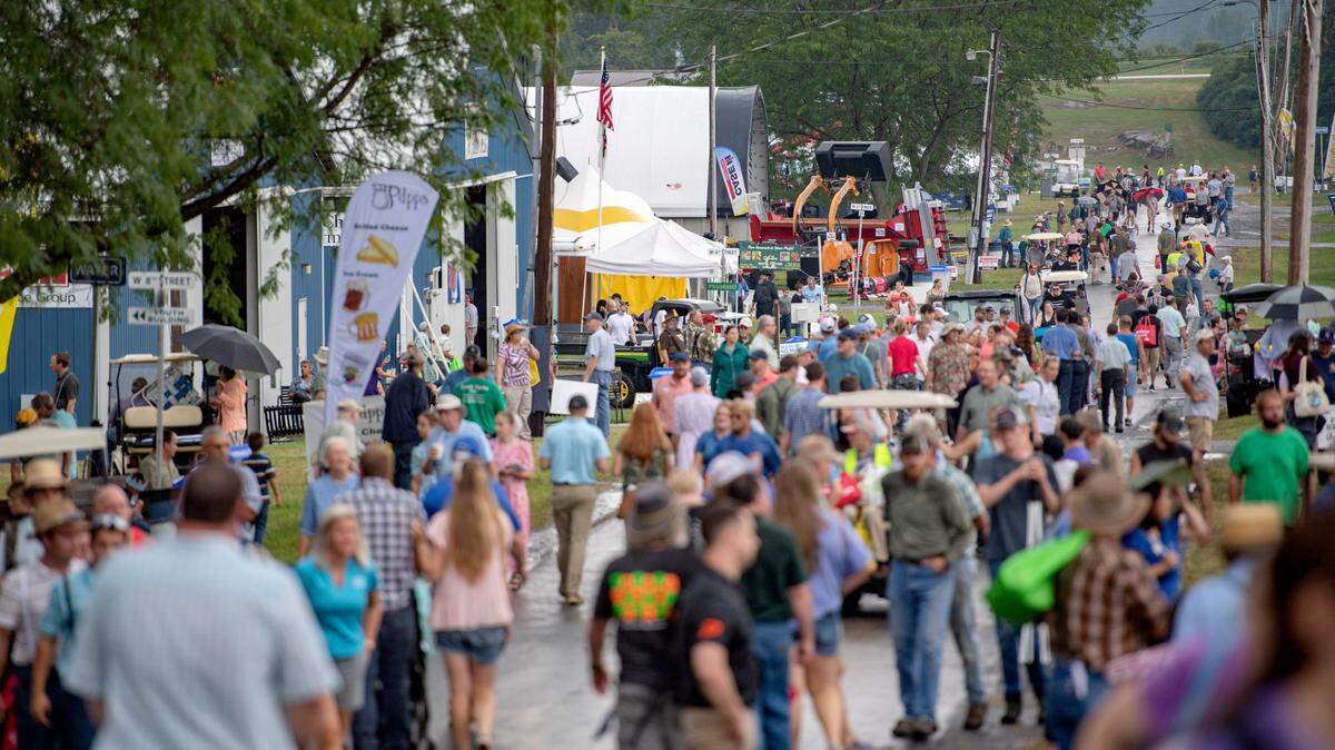 Visitors walk along the food stands at Ag Progress Days on Tuesday, Aug. 10, 2021.  